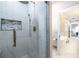 Modern shower with tiled walls, rainfall showerhead, and glass door at 883 Heritage Pl, Decatur, GA 30033