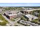 This aerial view captures the building's brick architecture, parking, and location near a train line and neighborhood at 170 Boulevard Se # E003, Atlanta, GA 30312
