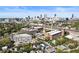 An aerial view of a historic brick building, surrounded by green trees, with a distant skyline view at 170 Boulevard Se # E003, Atlanta, GA 30312