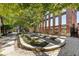 Outdoor space with trees, benches, and an old brick building at 170 Boulevard Se # E003, Atlanta, GA 30312