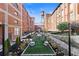 Beautifully landscaped courtyard featuring a water tower and sitting areas nestled between historic brick buildings at 170 Boulevard Se # E003, Atlanta, GA 30312
