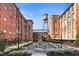 Charming courtyard with fireplace, seating, and lush landscaping at 170 Boulevard Se # E003, Atlanta, GA 30312