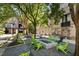 Community courtyard with a firepit and green chairs at 170 Boulevard Se # E003, Atlanta, GA 30312