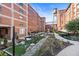 Beautifully landscaped courtyard featuring a water tower and sitting areas nestled between historic brick buildings at 170 Boulevard Se # E003, Atlanta, GA 30312