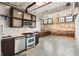 Modern kitchen with stainless steel appliances and sleek cabinetry, complemented by exposed brick and industrial accents at 170 Boulevard Se # E003, Atlanta, GA 30312