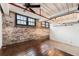 Stylish living area with exposed brick and industrial-inspired lighting at 170 Boulevard Se # E003, Atlanta, GA 30312