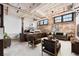 Spacious living room with raised bedroom area, modern furnishings, and exposed brick accent wall at 170 Boulevard Se # E003, Atlanta, GA 30312