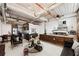 Open-concept living room boasts a raised bedroom, modern furnishings, and exposed ductwork at 170 Boulevard Se # E003, Atlanta, GA 30312