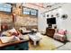 Bright, open living area with exposed brick, hard wood floors, and eclectic decor at 170 Boulevard Se # E003, Atlanta, GA 30312