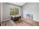 Sunlit bedroom features modern flooring, a serene color palette, and a charming accent table at 218 3Rd Ave, Avondale Estates, GA 30002