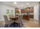 Eat-in kitchen with a dining table set and brown cabinetry at 218 3Rd Ave, Avondale Estates, GA 30002