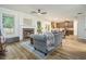 Comfortable living room featuring a cozy fireplace, hardwood floors, and an open layout at 218 3Rd Ave, Avondale Estates, GA 30002