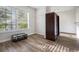 Walk-in closet featuring hardwood floors, window and built-in shelves for organized storage and ample natural light at 218 3Rd Ave, Avondale Estates, GA 30002