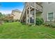 A backyard view showing landscaping, green lawn, and multi-level decks at 544 Pine Way, Dallas, GA 30157