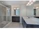 Bright bathroom featuring a shower, and double vanity with solid surface counters and tiled floors at 544 Pine Way, Dallas, GA 30157