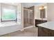 Bathroom features a soaking tub, separate shower, and dual vanities at 544 Pine Way, Dallas, GA 30157