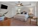 Inviting bedroom featuring a trey ceiling, carpet, fan, and neutral decor at 544 Pine Way, Dallas, GA 30157