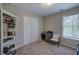 Bedroom featuring a window, neutral colors, and closet at 544 Pine Way, Dallas, GA 30157