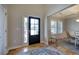 Bright foyer with hardwood floors, a decorative rug, and a glimpse into the dining area at 544 Pine Way, Dallas, GA 30157