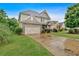 Lovely two-story home featuring a stone-accented garage and well-maintained landscaping at 544 Pine Way, Dallas, GA 30157