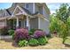 Landscaped front yard with various bushes and greenery enhancing the home's exterior at 544 Pine Way, Dallas, GA 30157