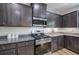 Elegant kitchen featuring granite counters, stainless steel appliances, and subway tile backsplash at 544 Pine Way, Dallas, GA 30157