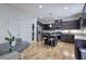 Modern kitchen boasts stainless steel appliances, an island with seating, and granite countertops at 544 Pine Way, Dallas, GA 30157