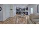 Open kitchen and dining area with stainless appliances and hardwood floors at 544 Pine Way, Dallas, GA 30157
