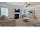 Cozy living room with a fireplace, neutral decor, hardwood floors, and plenty of seating at 544 Pine Way, Dallas, GA 30157