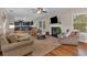 Comfortable living room with fireplace, hardwood floors, and furniture at 544 Pine Way, Dallas, GA 30157