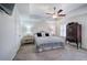 Tranquil primary bedroom features tray ceilings, a ceiling fan, plush carpet and great natural light at 544 Pine Way, Dallas, GA 30157