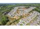 A community aerial view showing houses, amenities, and pond at 6435 Privet Way, Cumming, GA 30028