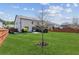 A spacious, well-maintained backyard with a wooden fence offers plenty of room for outdoor activities at 6435 Privet Way, Cumming, GA 30028