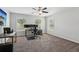 Spacious bonus room with natural light from two windows, set up as an office at 6435 Privet Way, Cumming, GA 30028
