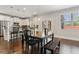 Bright dining area with stainless steel appliances, a dark table and a window at 6435 Privet Way, Cumming, GA 30028