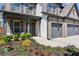 Charming home exterior with well-kept landscaping, a welcoming porch, and a spacious two-car garage at 6435 Privet Way, Cumming, GA 30028