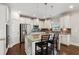 Modern kitchen featuring granite countertops, stainless steel appliances, and a convenient center island at 6435 Privet Way, Cumming, GA 30028