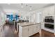 Open concept kitchen with granite island flowing into the living room at 6435 Privet Way, Cumming, GA 30028