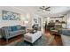 Spacious living room with fireplace, hardwood floors, and open concept design at 6435 Privet Way, Cumming, GA 30028