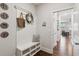 Functional mudroom area with built-in bench and storage at 6435 Privet Way, Cumming, GA 30028