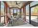 This is the sun room with curtains at 6435 Privet Way, Cumming, GA 30028