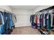 This walk-in closet offers plenty of storage, hanging space and organization for your wardrobe and shoes at 6435 Privet Way, Cumming, GA 30028