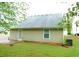 Home's backyard features green grass and window at 6991 Bonnes Blvd, Austell, GA 30168