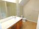 Bathroom with vanity, sink, toilet, and large mirror at 6991 Bonnes Blvd, Austell, GA 30168