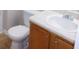 Bathroom featuring single sink vanity with honey wood cabinets and laminate countertop at 6991 Bonnes Blvd, Austell, GA 30168