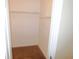 Walk-in closet with neutral walls, carpeting and metal racks for optimal storage at 6991 Bonnes Blvd, Austell, GA 30168