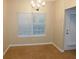 Cozy dining room with tan walls, carpet flooring, and natural light from window at 6991 Bonnes Blvd, Austell, GA 30168