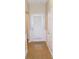 Inviting entryway with neutral paint and a door with window pane at 6991 Bonnes Blvd, Austell, GA 30168