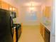 Functional kitchen equipped with modern black appliances and ample cabinet space at 6991 Bonnes Blvd, Austell, GA 30168