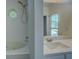 This is a bathroom with a bathtub and sink at 70 Graystone Dr, Covington, GA 30014